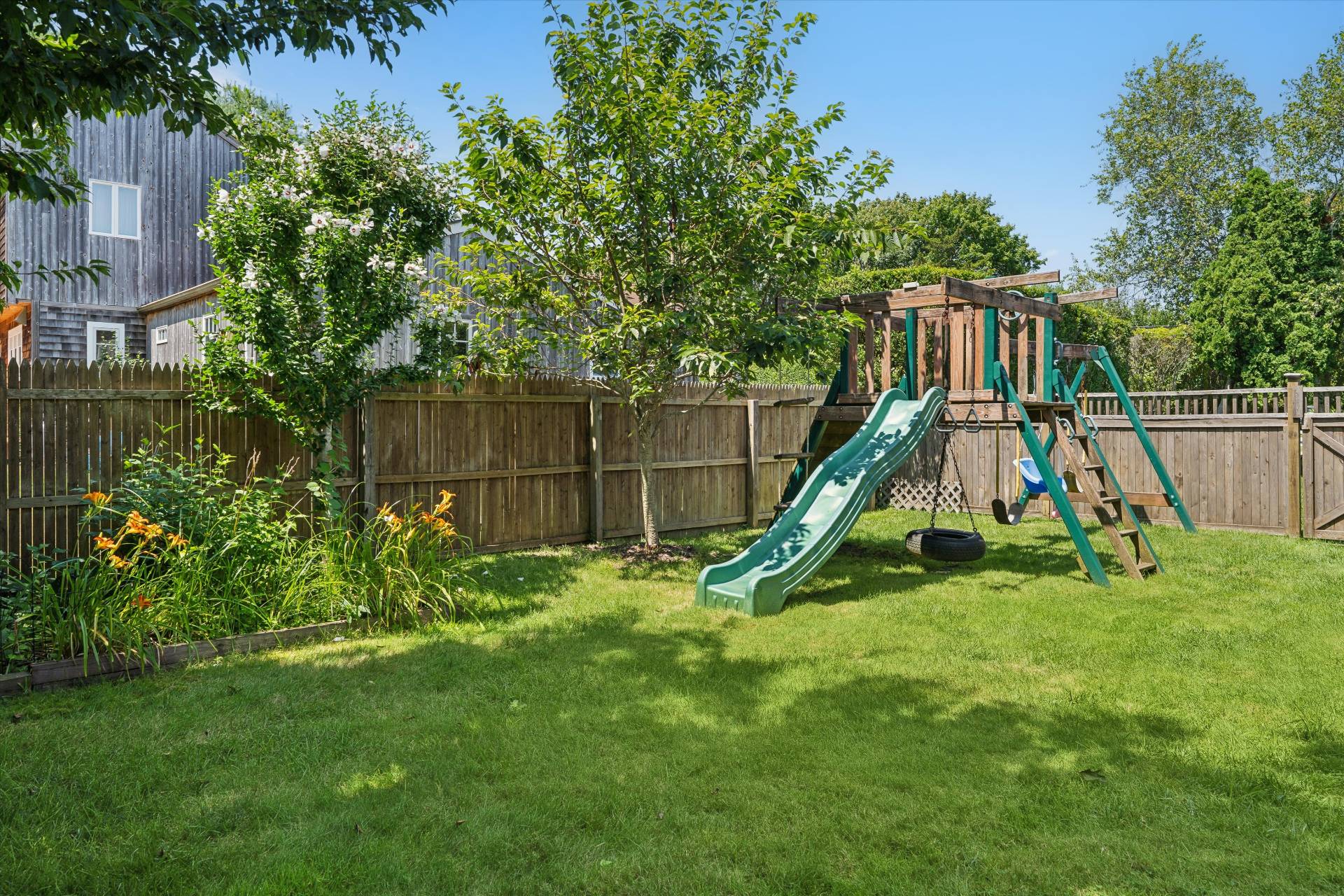 27 South Country Road Westhampton, NY 11977 - Photo 15 of 16 a view of a house with a park