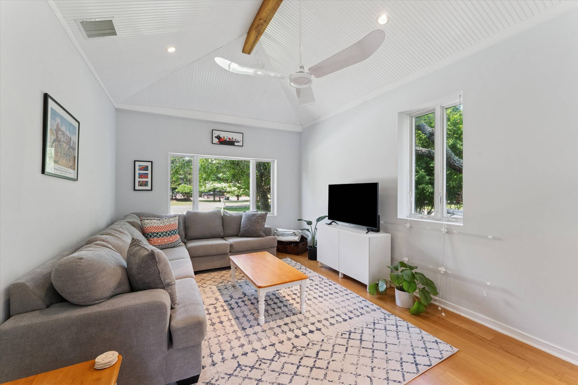 27 South Country Road Westhampton, NY 11977 - Photo 6 of 16 a living room with furniture and a flat screen tv