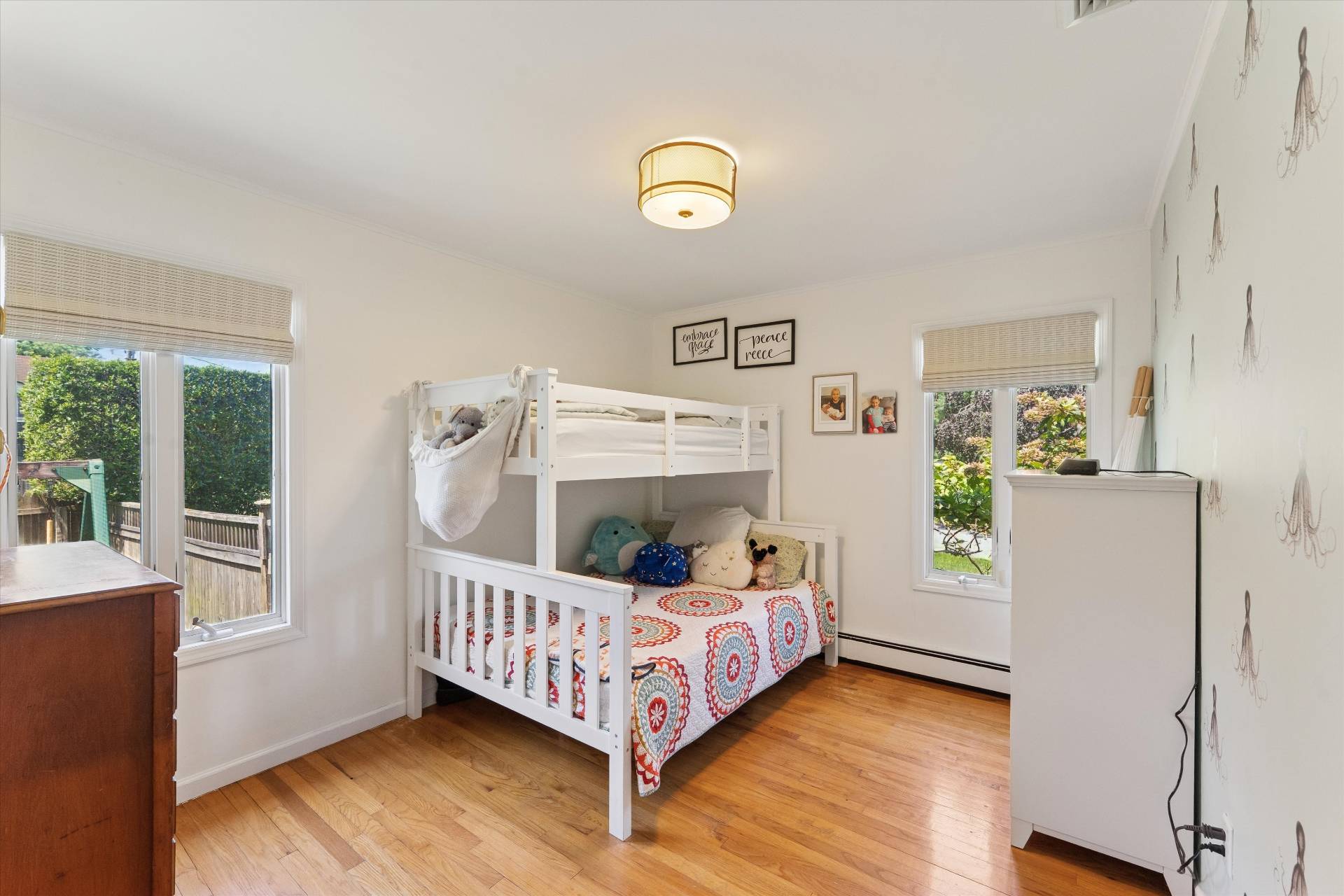 27 South Country Road Westhampton, NY 11977 - Photo 9 of 16 a bedroom with furniture and a window