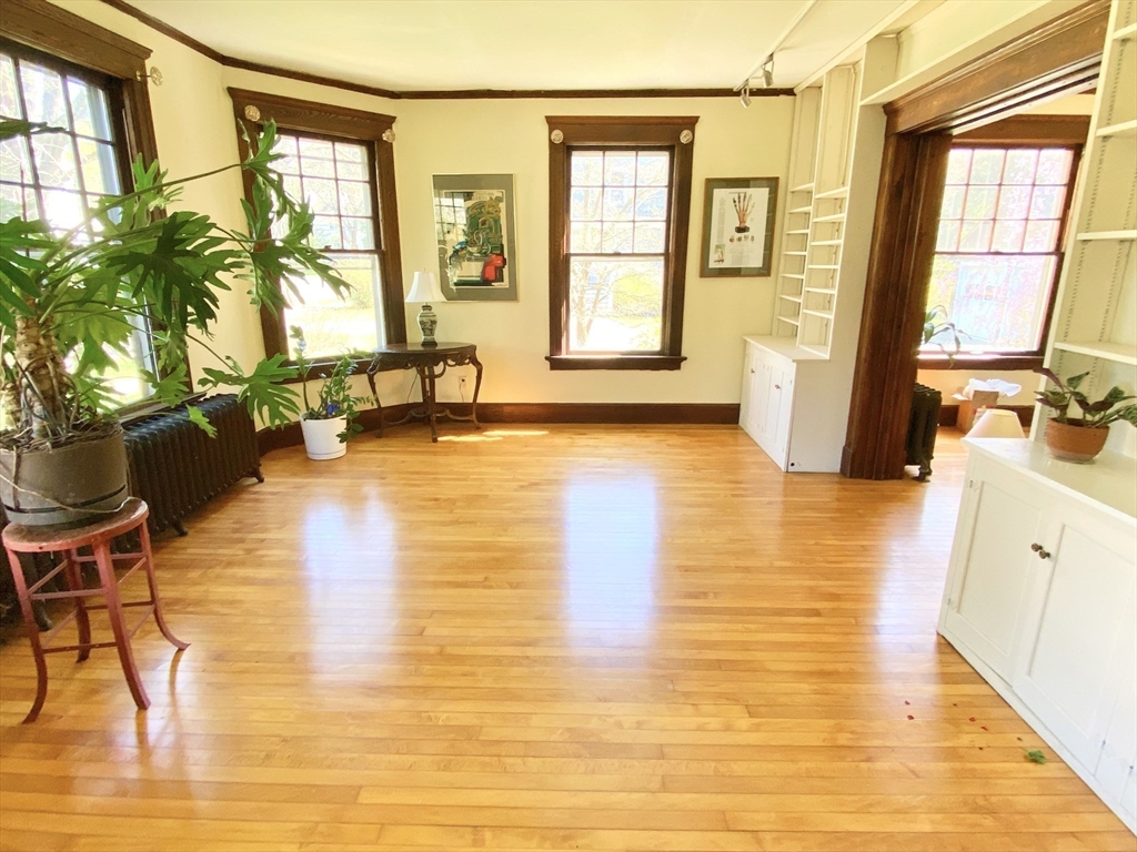 14 Nutting Avenue Amherst, MA 01002 - Photo 16 of 41 a view of a living room with kitchen floor and a large window
