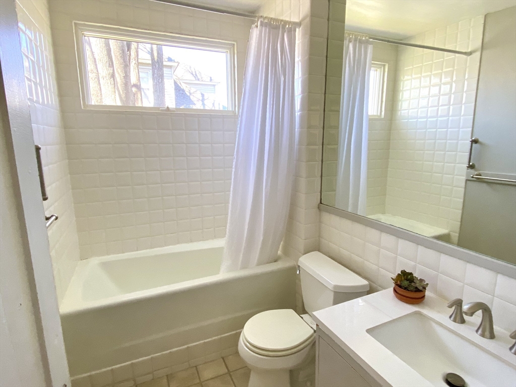 14 Nutting Avenue Amherst, MA 01002 - Photo 28 of 41 a bathroom with a sink a toilet and shower