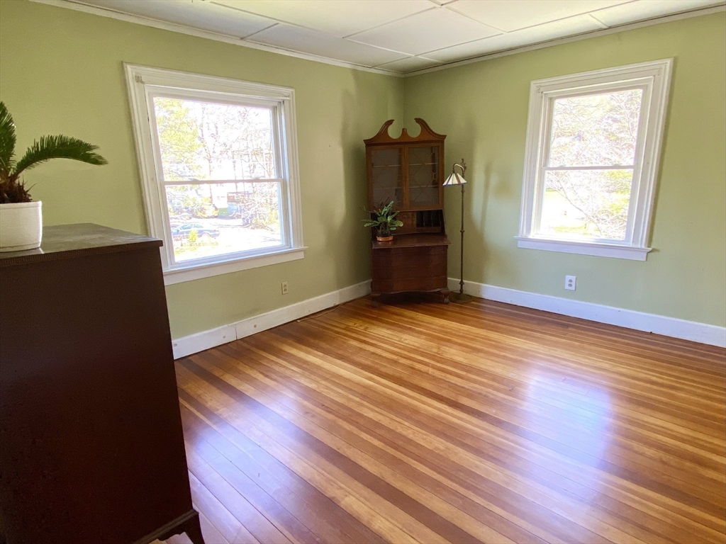 14 Nutting Avenue Amherst, MA 01002 - Photo 29 of 41 a view of an empty room with wooden floor and a window