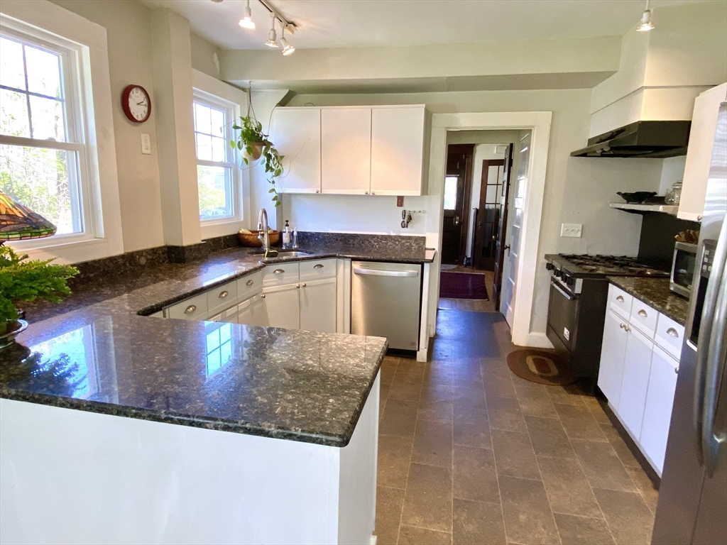 14 Nutting Avenue Amherst, MA 01002 - Photo 5 of 41 a kitchen with stainless steel appliances granite countertop a sink stove and refrigerator
