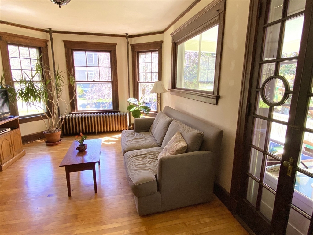 14 Nutting Avenue Amherst, MA 01002 - Photo 9 of 41 a living room with furniture and a floor to ceiling window