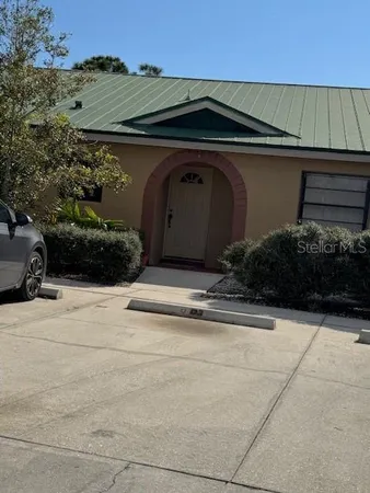 a view of backyard with green space
