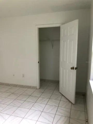 an empty room with a bathroom
