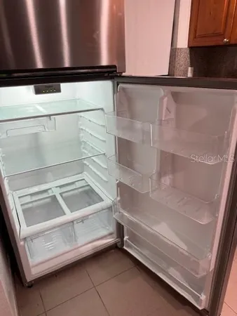 a stove top oven sitting inside of a kitchen