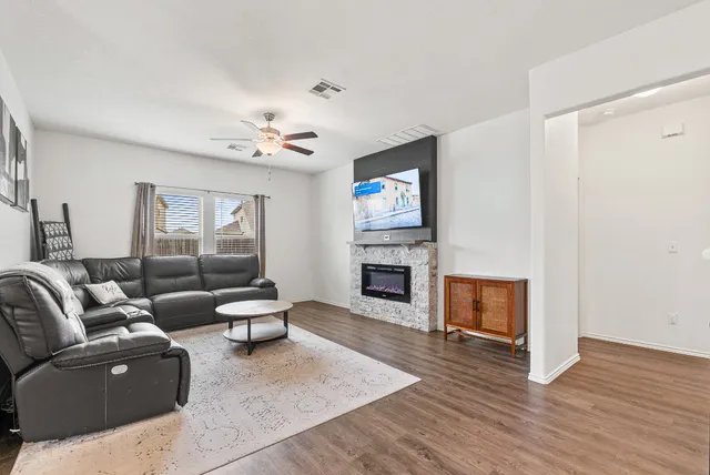 a living room with furniture and a fireplace