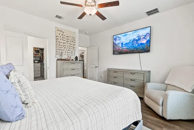 a bedroom with a bed and a couch