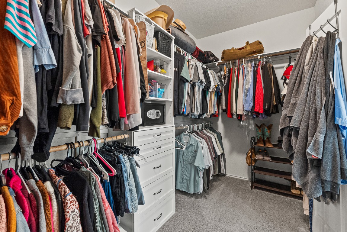 136 Copper Lane Kyle, TX 78640 - Photo 18 of 33 a view of walk in closet with clothes