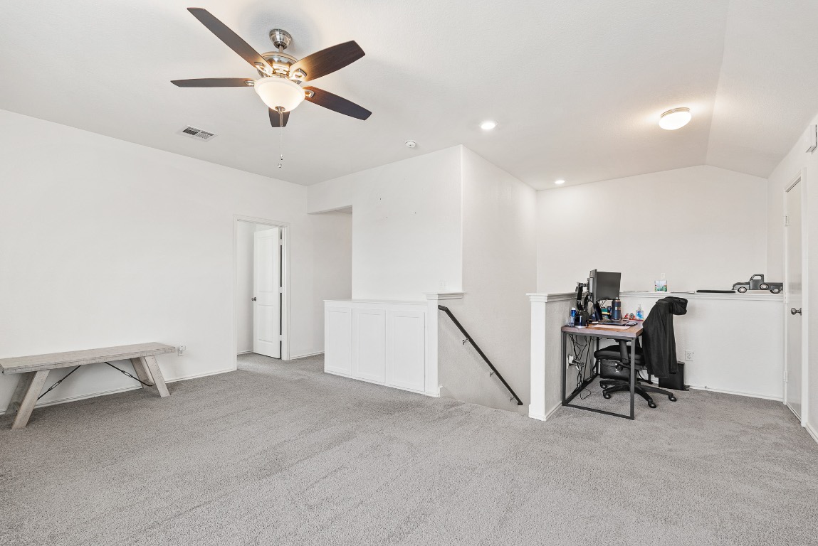 136 Copper Lane Kyle, TX 78640 - Photo 21 of 33 a view of a workspace with furniture and a ceiling fan