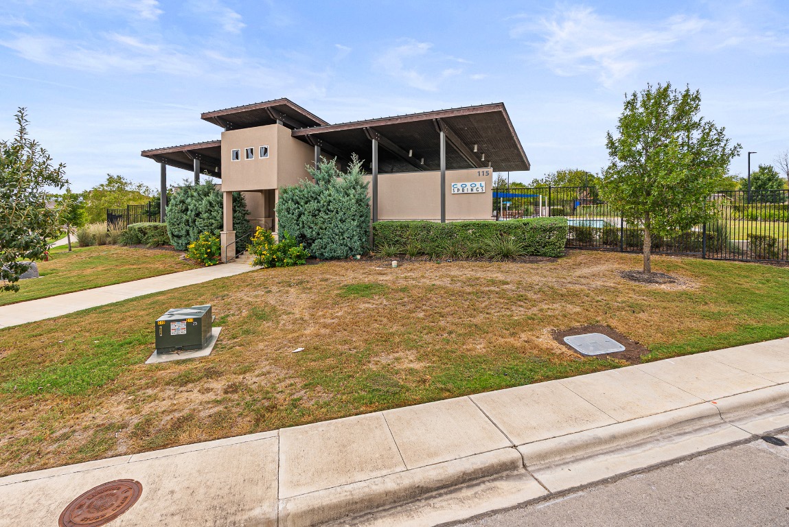 136 Copper Lane Kyle, TX 78640 - Photo 32 of 33 a front view of a house with a yard