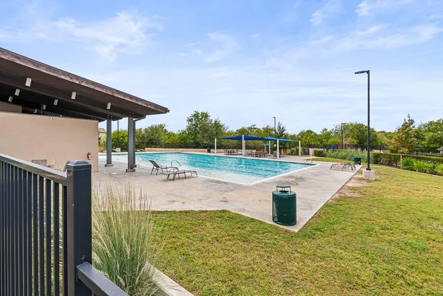 a view of a swimming pool with a patio