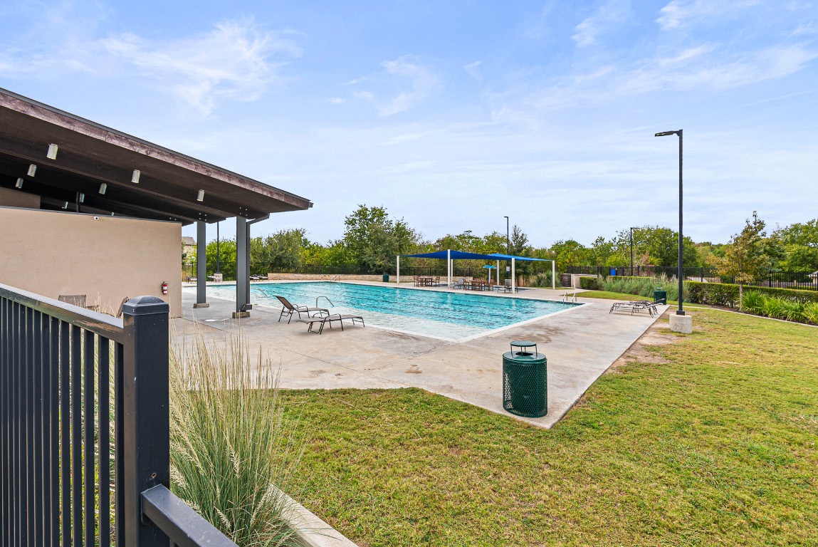 136 Copper Lane Kyle, TX 78640 - Photo 33 of 33 a view of a swimming pool with a patio