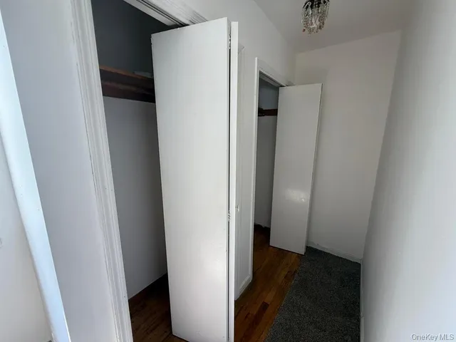 a view of a hallway with a refrigerator