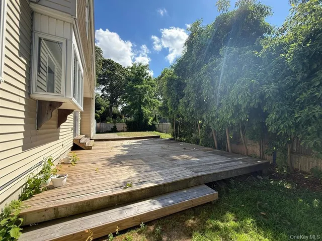 a view of a backyard with sitting area