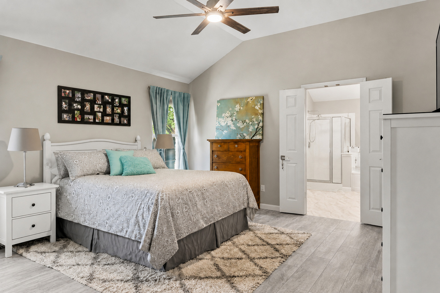 1921 Rutherford Drive Leander, TX 78641 - Photo 17 of 29 Angled ceilings and wood-look flooring establish a relaxed atmosphere in this comfortable suite. Virtually Staged.