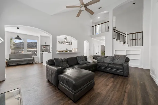 a dining room with furniture and wooden floor