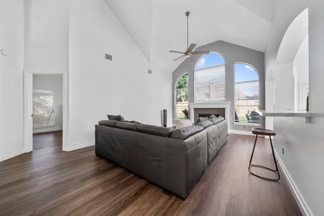a living room with furniture and a fireplace