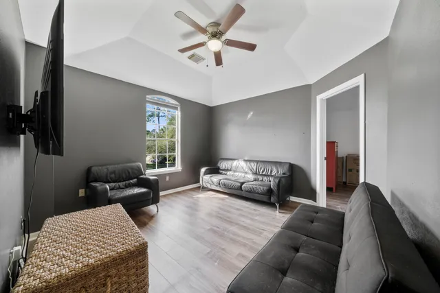 a bathroom with a double vanity sink a mirror and a bathtub