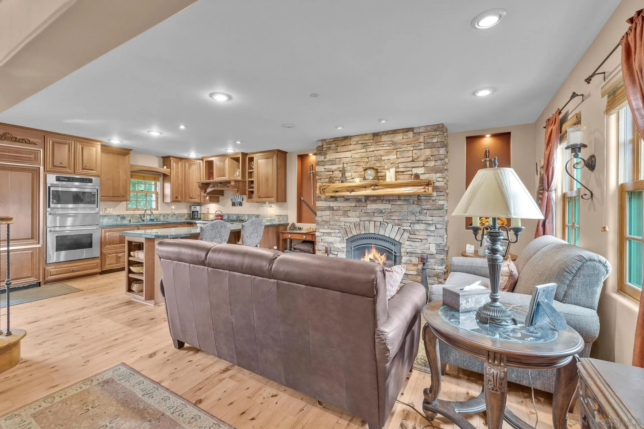 3839 Deer Lake Park Road Julian, CA 92036 - Photo 19 of 74 a living room with fireplace furniture and a large window