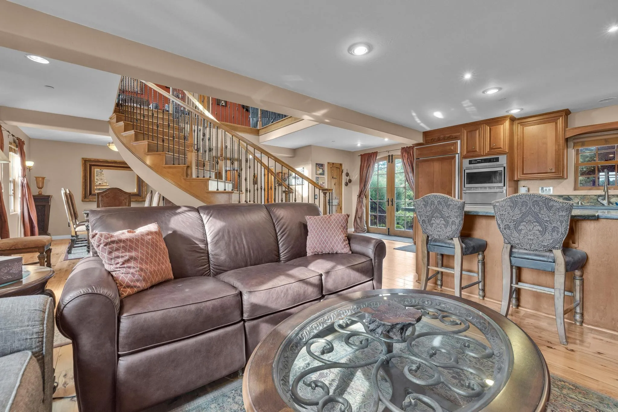 3839 Deer Lake Park Road Julian, CA 92036 - Photo 20 of 74 a living room with furniture a wooden floor and a chandelier