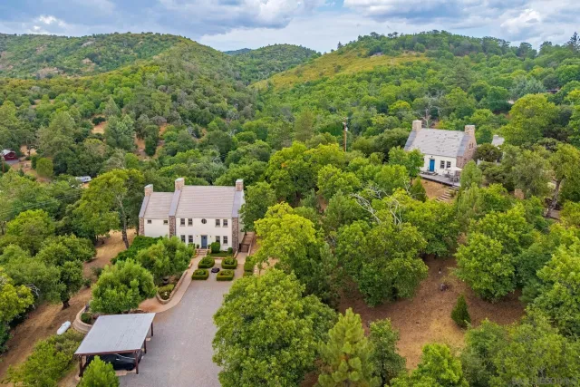 an aerial view of a house with a garden