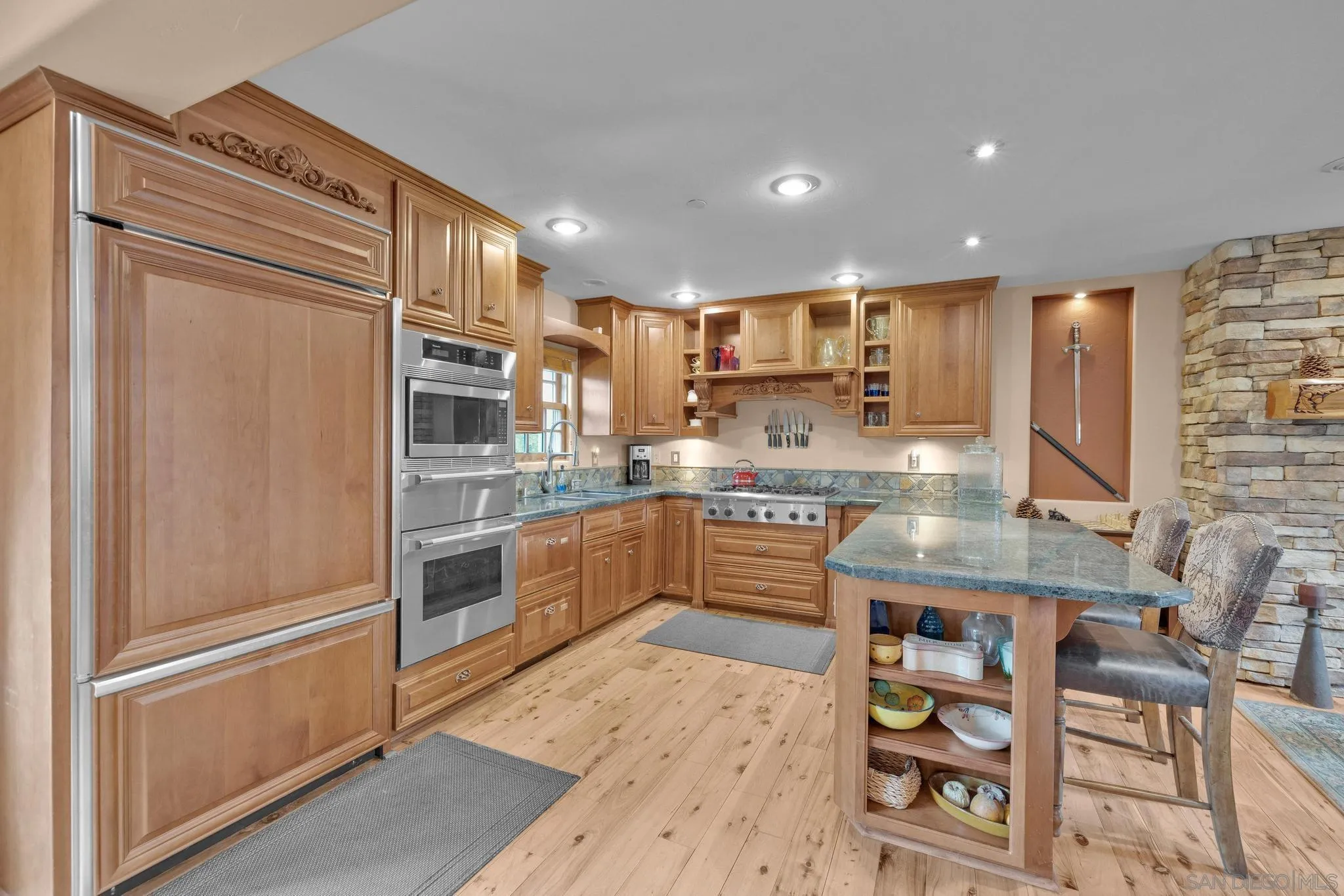3839 Deer Lake Park Road Julian, CA 92036 - Photo 24 of 74 a kitchen with stainless steel appliances granite countertop a refrigerator and a stove top oven