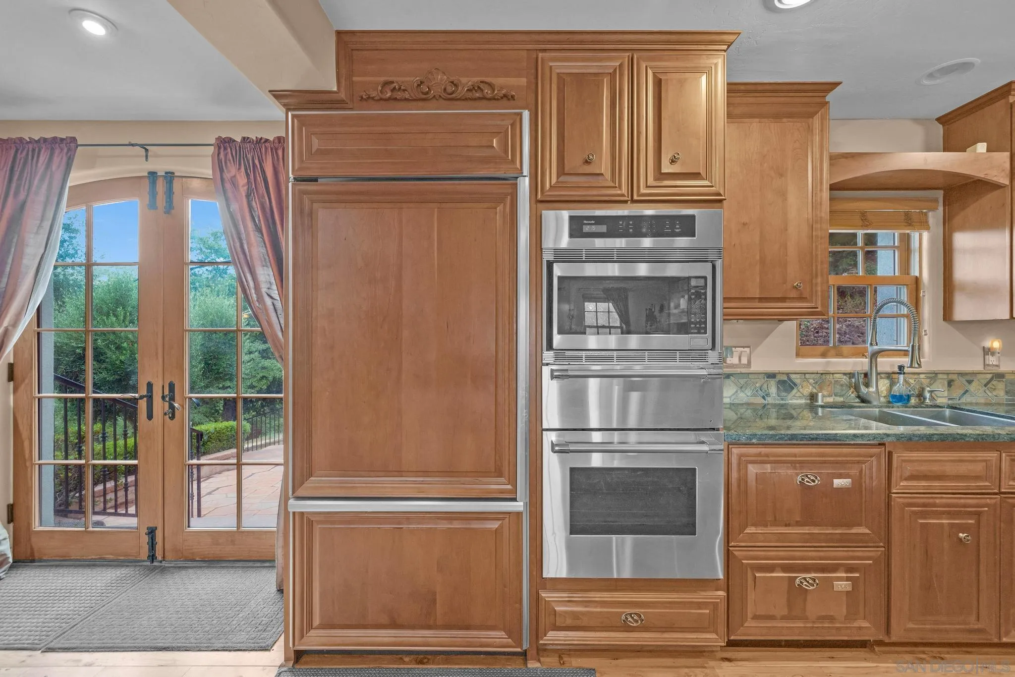 3839 Deer Lake Park Road Julian, CA 92036 - Photo 25 of 74 a kitchen with stainless steel appliances granite countertop a refrigerator and cabinets