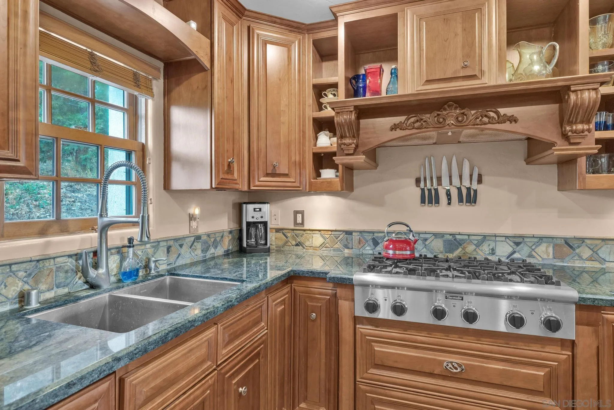 3839 Deer Lake Park Road Julian, CA 92036 - Photo 26 of 74 a kitchen with stainless steel appliances granite countertop a sink and a stove