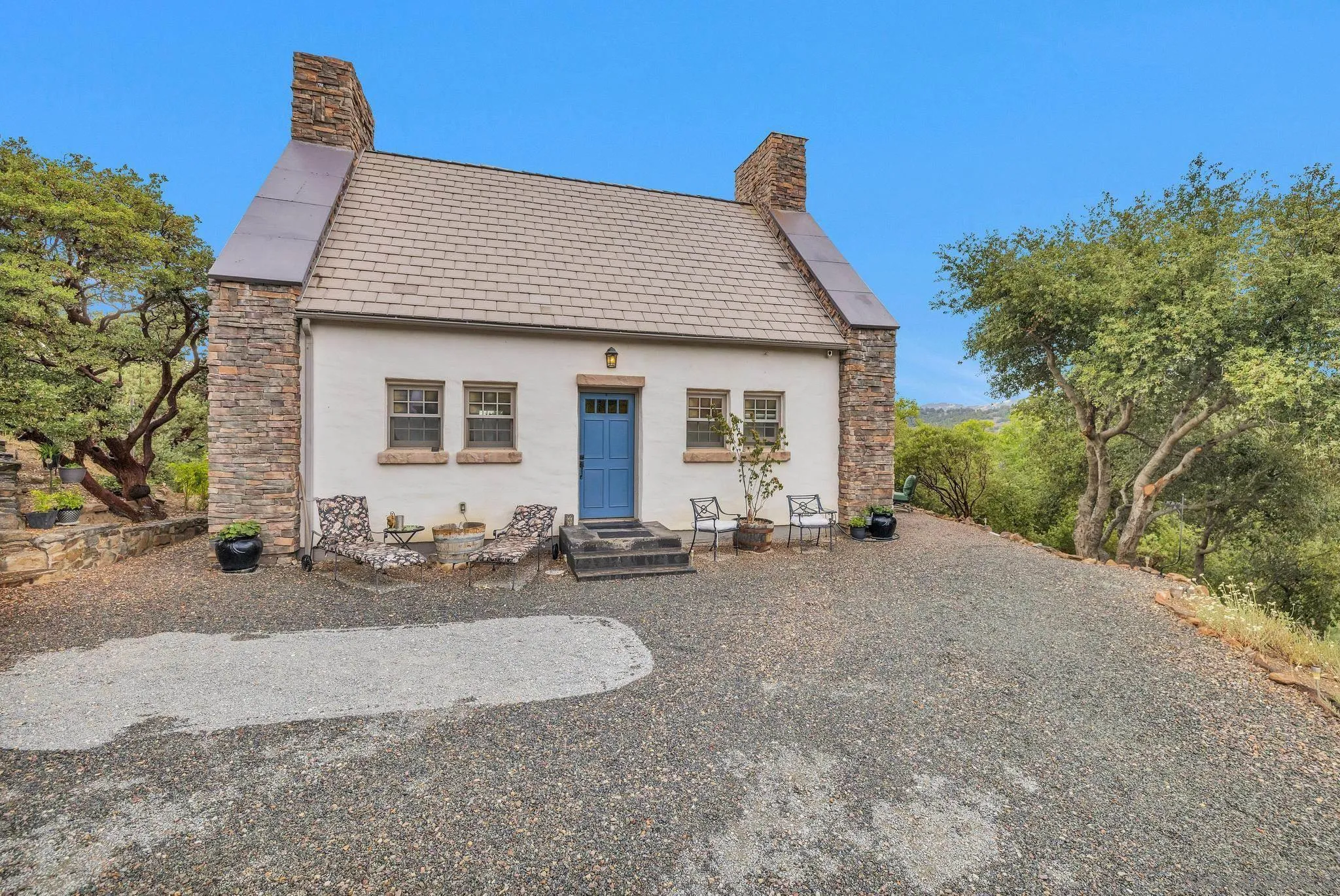 3839 Deer Lake Park Road Julian, CA 92036 - Photo 3 of 74 a front view of a house with a yard and garage