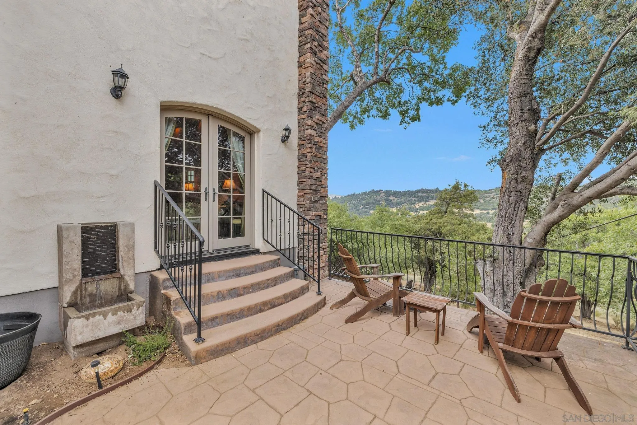 3839 Deer Lake Park Road Julian, CA 92036 - Photo 37 of 74 a view of a chair and tables in the back yard of the house