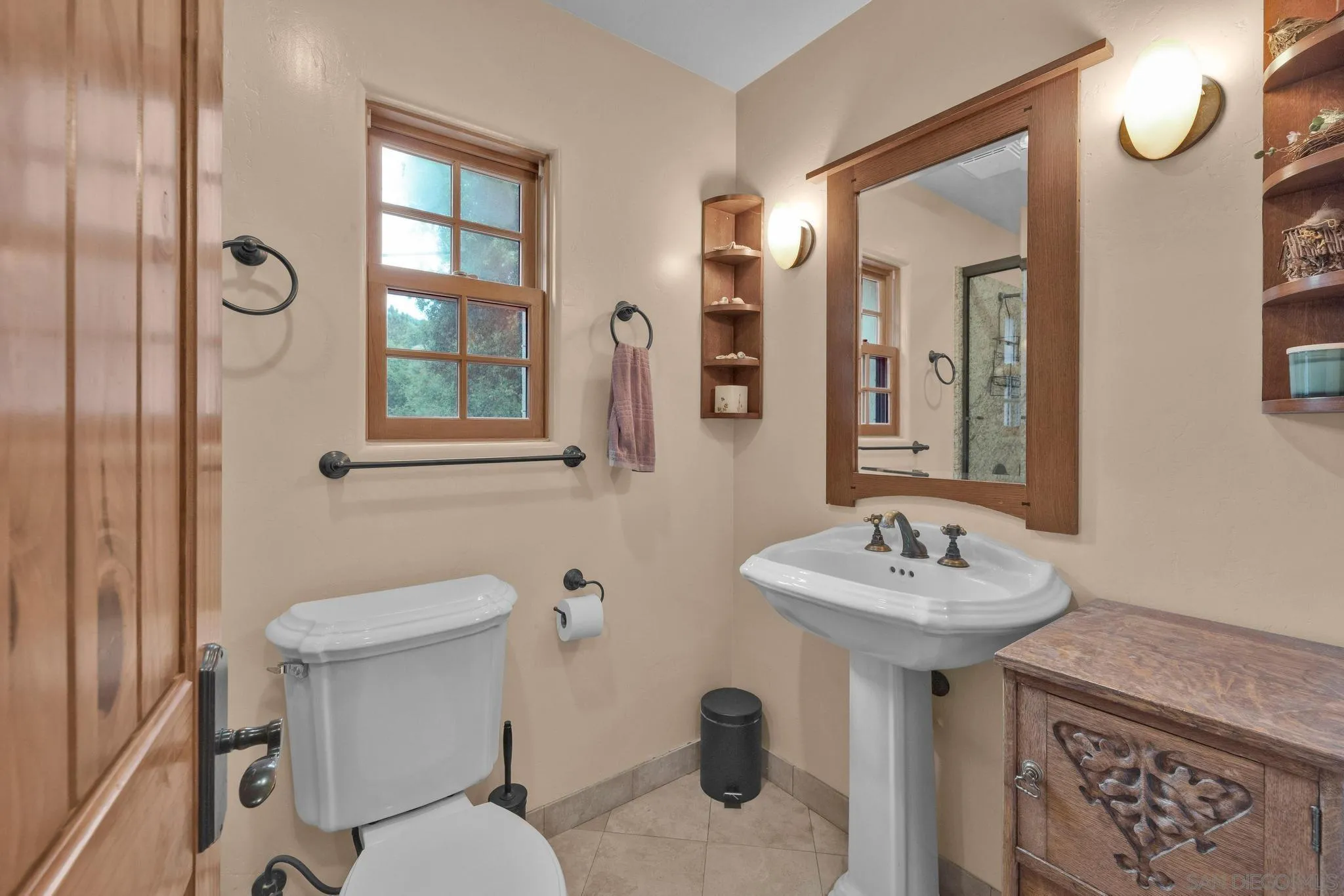3839 Deer Lake Park Road Julian, CA 92036 - Photo 39 of 74 a bathroom with a sink mirror toilet and next to a window