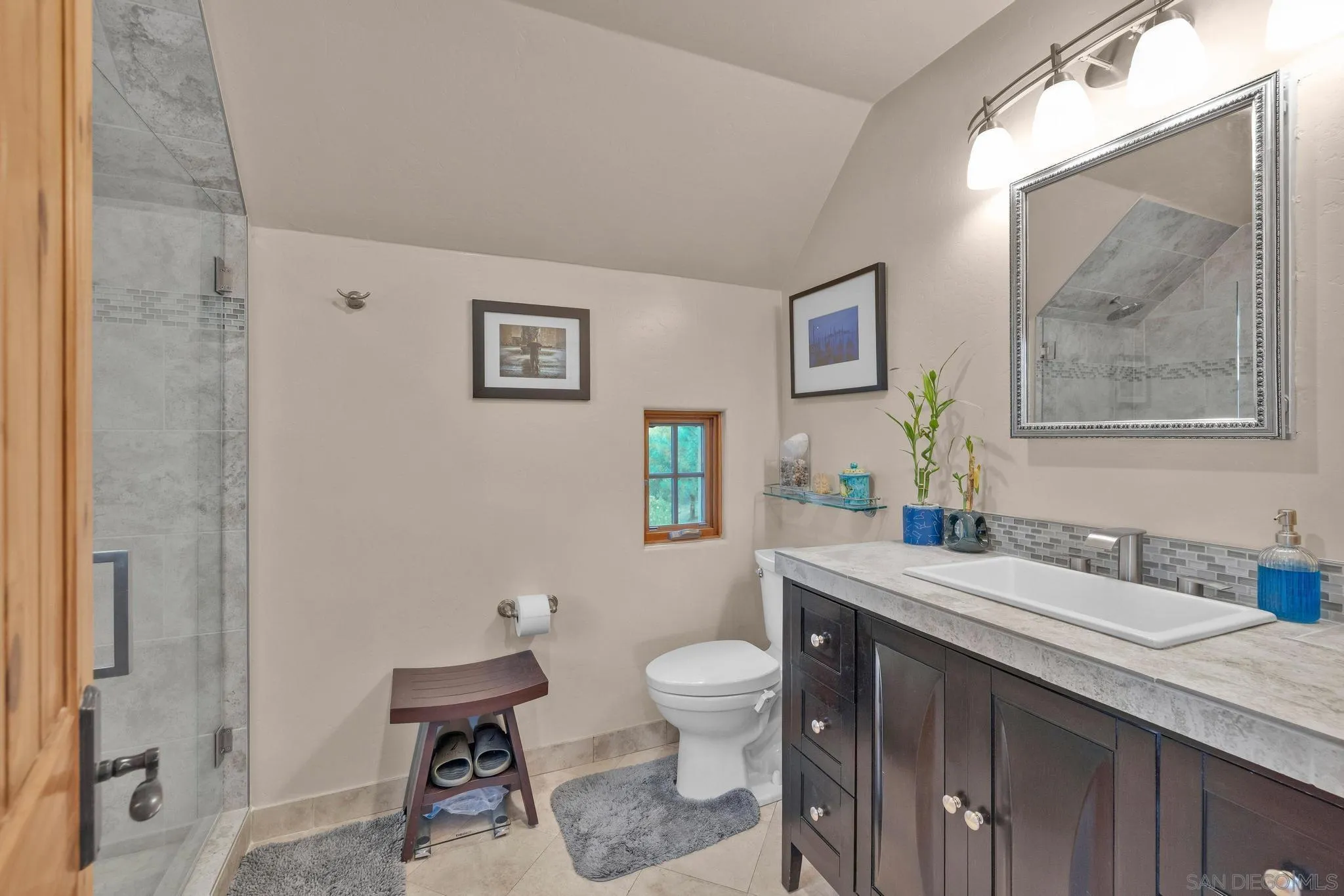 3839 Deer Lake Park Road Julian, CA 92036 - Photo 48 of 74 a bathroom with a granite countertop sink a toilet and a mirror
