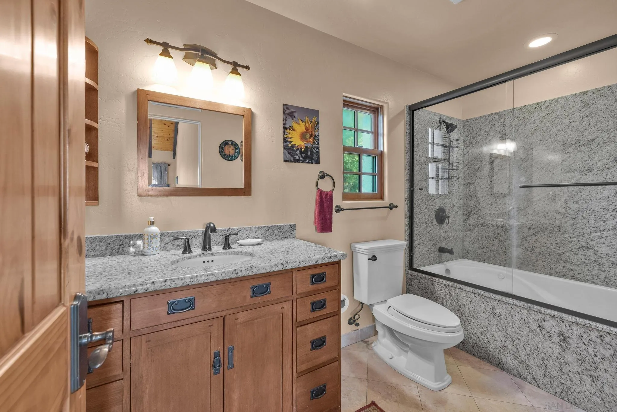 3839 Deer Lake Park Road Julian, CA 92036 - Photo 52 of 74 a bathroom with a granite countertop sink toilet and shower