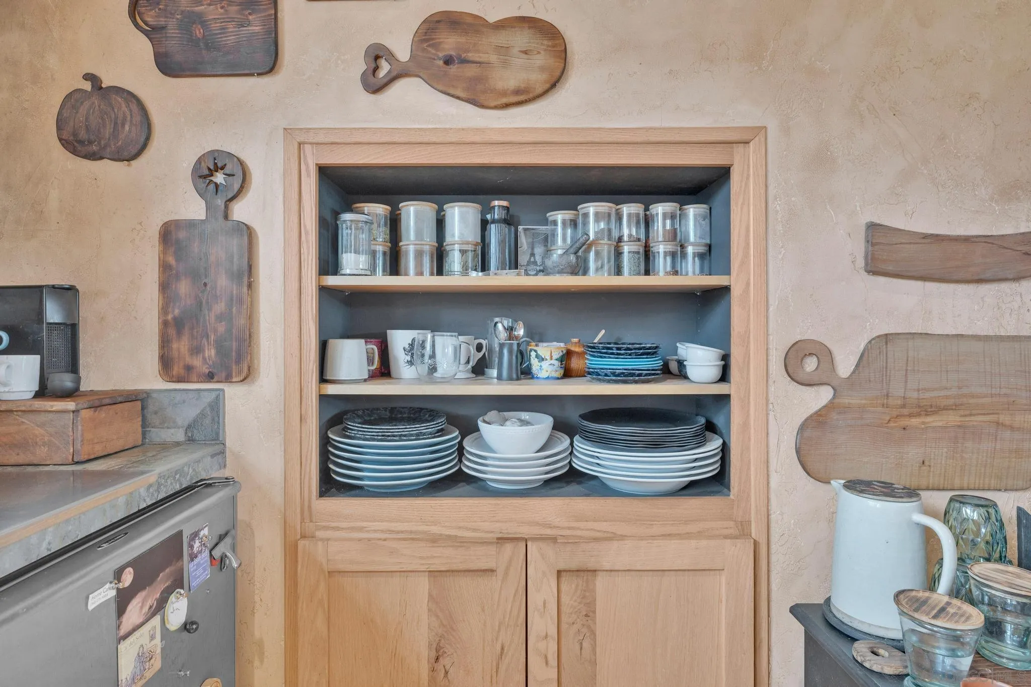 3839 Deer Lake Park Road Julian, CA 92036 - Photo 60 of 74 a shelf with books and knick knacks on it