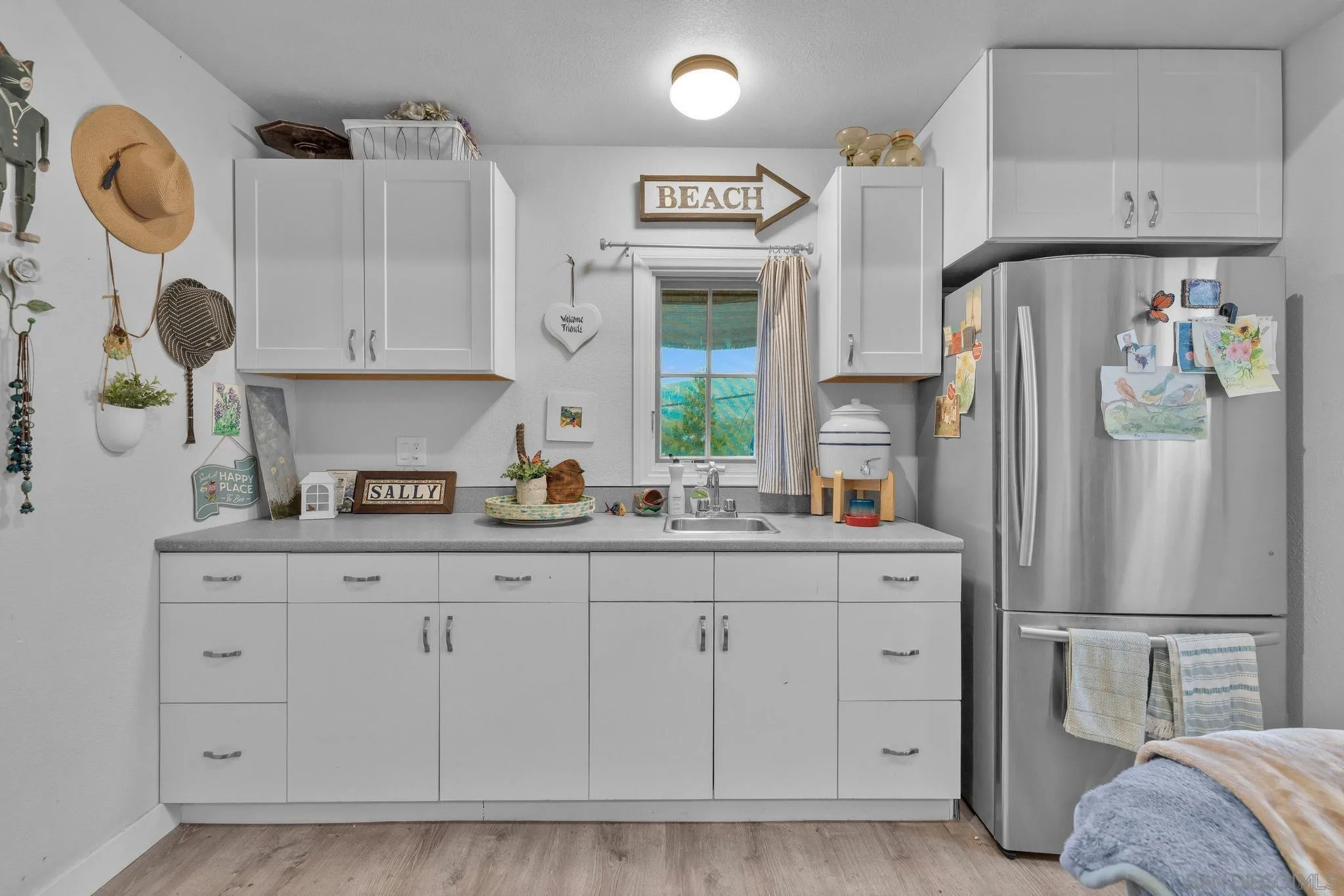 3839 Deer Lake Park Road Julian, CA 92036 - Photo 72 of 74 a kitchen with stainless steel appliances a refrigerator sink and cabinets
