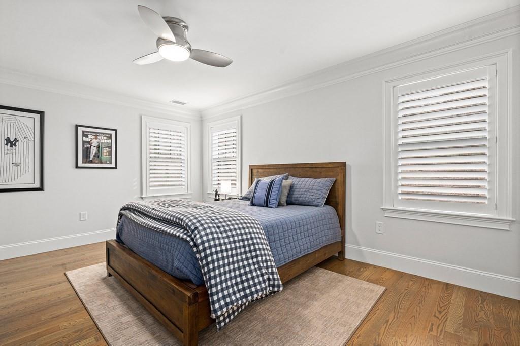 6 Johnson Road Winchester, MA 01890 - Photo 24 of 42 a bedroom with a bed lamp and a window