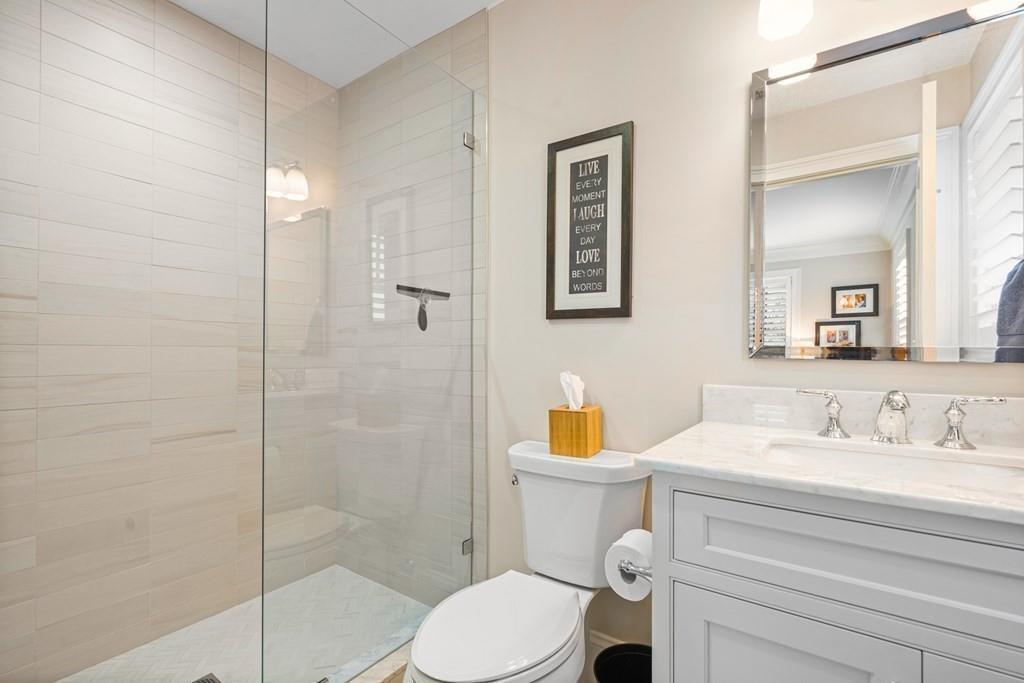 6 Johnson Road Winchester, MA 01890 - Photo 25 of 42 a bathroom with a toilet sink vanity and shower