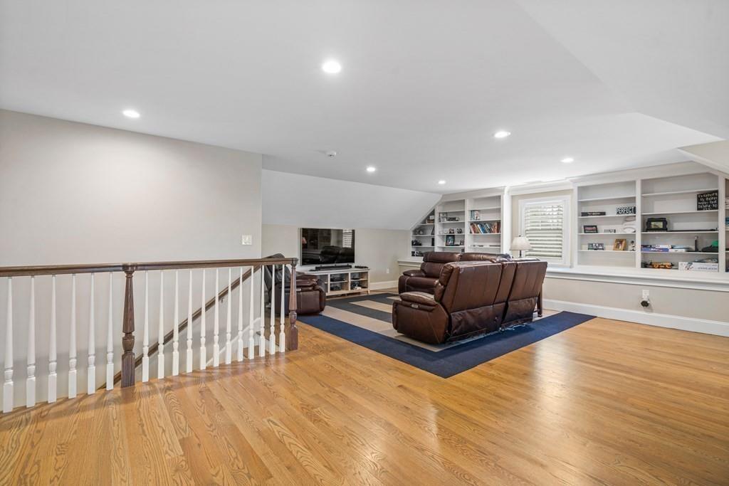 6 Johnson Road Winchester, MA 01890 - Photo 28 of 42 a living room with furniture and a flat screen tv