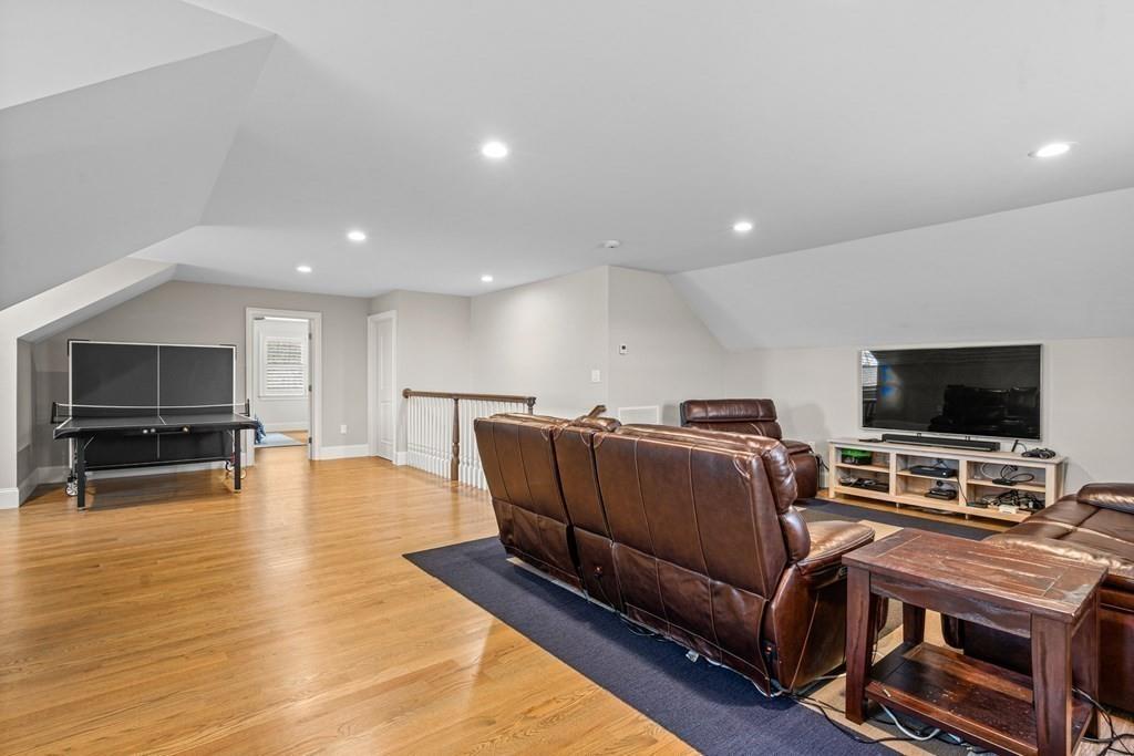 6 Johnson Road Winchester, MA 01890 - Photo 29 of 42 a living room with furniture and a flat screen tv