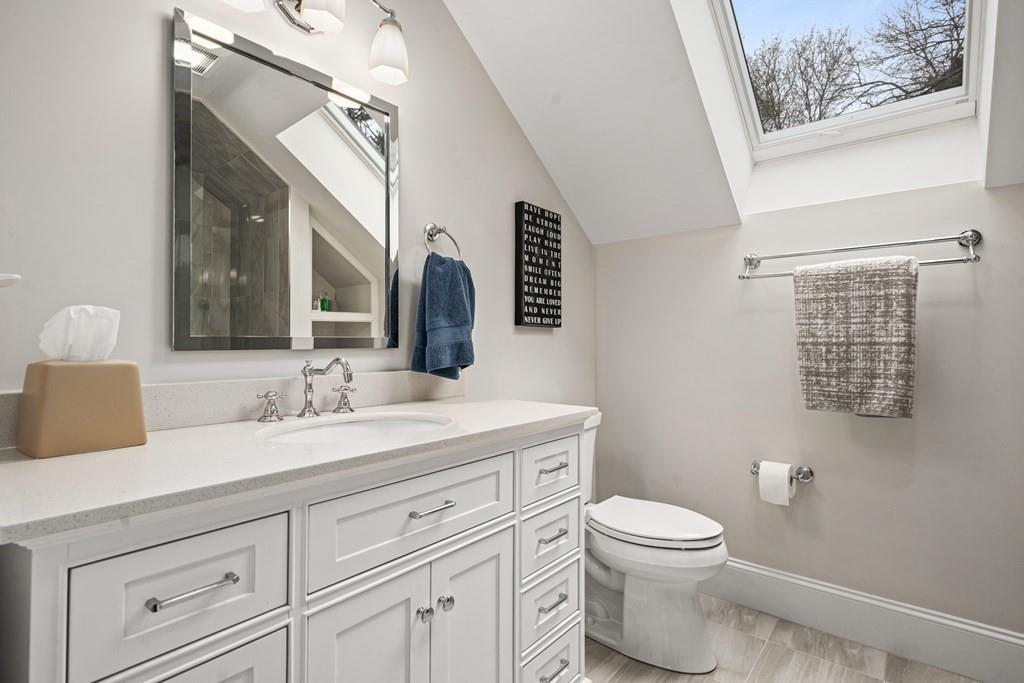 6 Johnson Road Winchester, MA 01890 - Photo 31 of 42 a bathroom with a toilet a sink and mirror