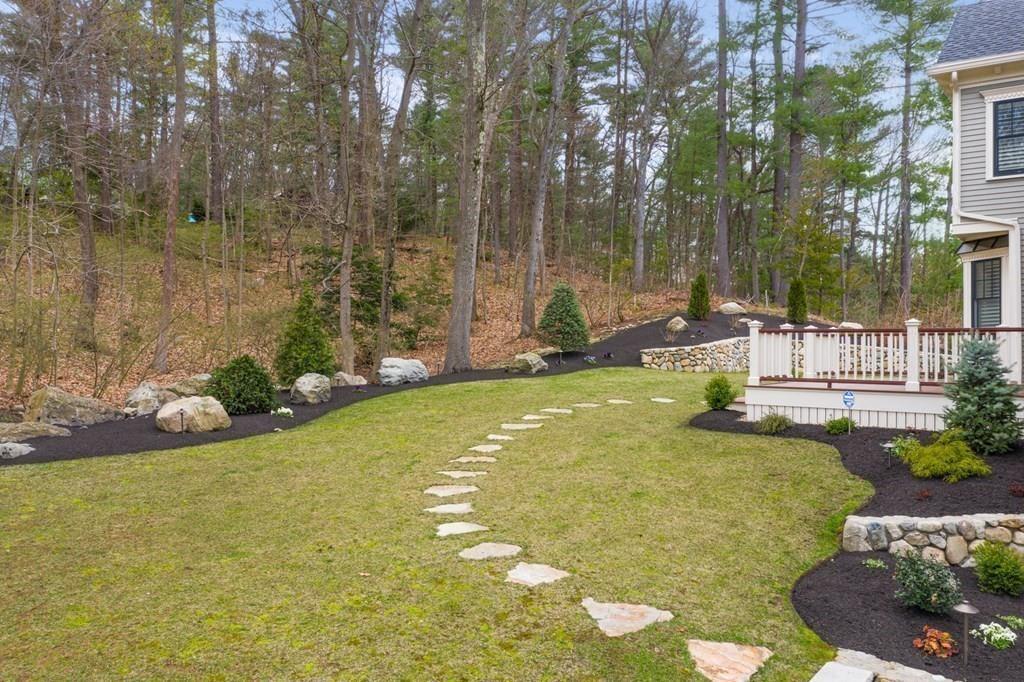 6 Johnson Road Winchester, MA 01890 - Photo 36 of 42 a view of swimming pool with lawn chairs and plants