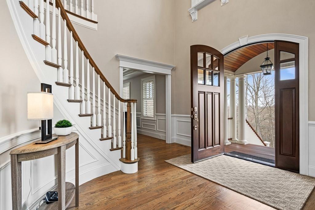 6 Johnson Road Winchester, MA 01890 - Photo 4 of 42 a view of staircase with wooden floor and a rug