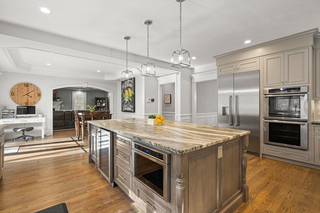 6 Johnson Road Winchester, MA 01890 - Photo 8 of 42 a kitchen with stainless steel appliances granite countertop a stove and a refrigerator