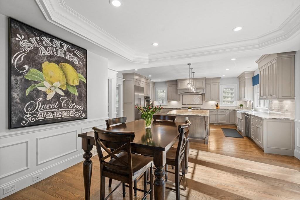 6 Johnson Road Winchester, MA 01890 - Photo 10 of 42 a view of a dining room with furniture and wooden floor