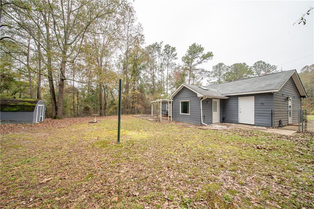 143 Lee Road 979 Phenix City, AL 36870 - Photo 11 of 37 View of yard with a shed