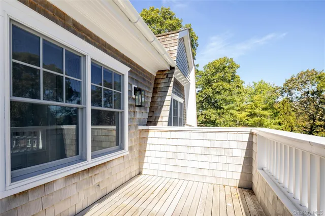 a view of a balcony with a potted plant