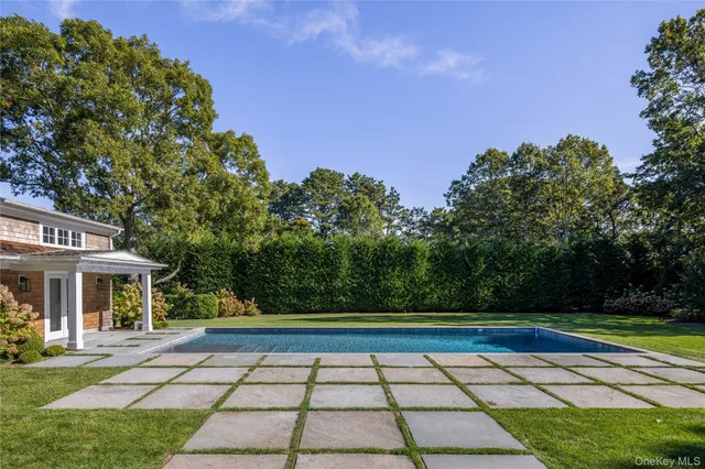 a view of a yard and front view of a house