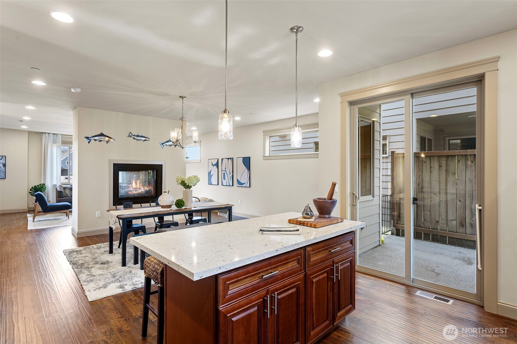 553 Southeast Andrews Street, Unit B Issaquah, WA 98027 - Photo 14 of 28 a kitchen with a stove a refrigerator a sink a dining table and chairs